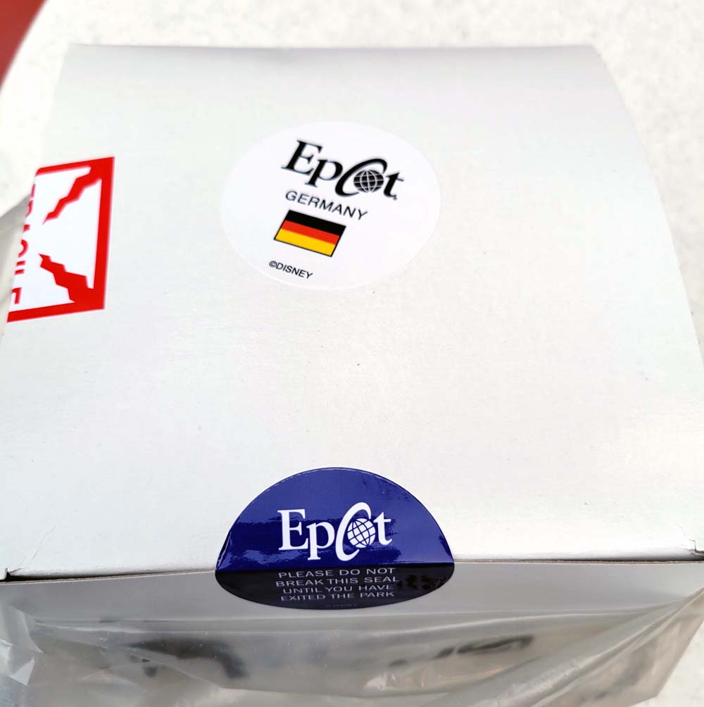 white box with epcot germany sticker and a blue consumption warning sticker EPCOT