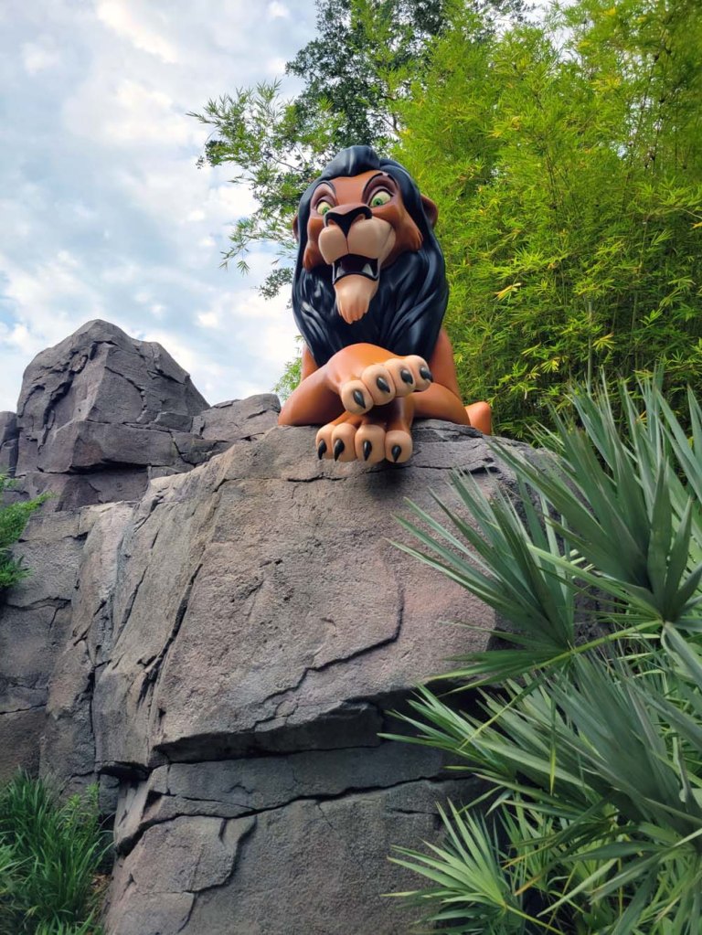Art of Animation - The Lion King - Scar, laying on an opposing rock