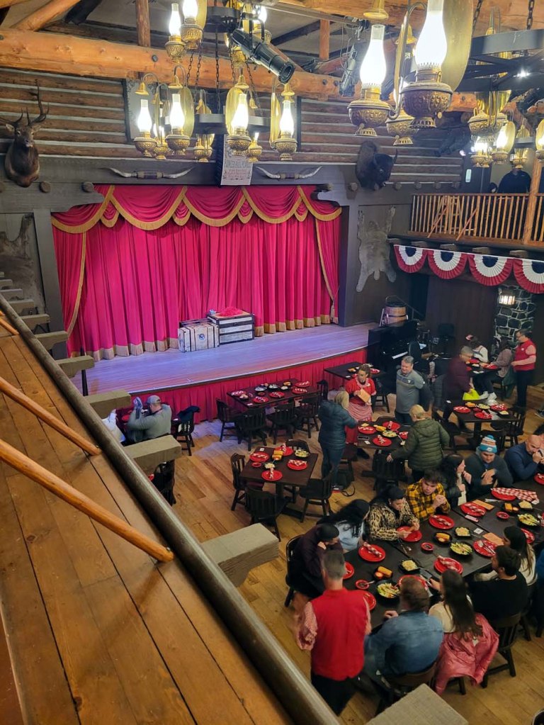 Balcony perspective of the floor below with the main stage clearly in view - Hoop-De-Doo Musical Revue